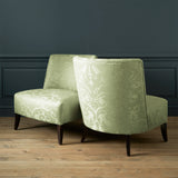 Armchairs in a contemporary damask fabric with a light green colours.