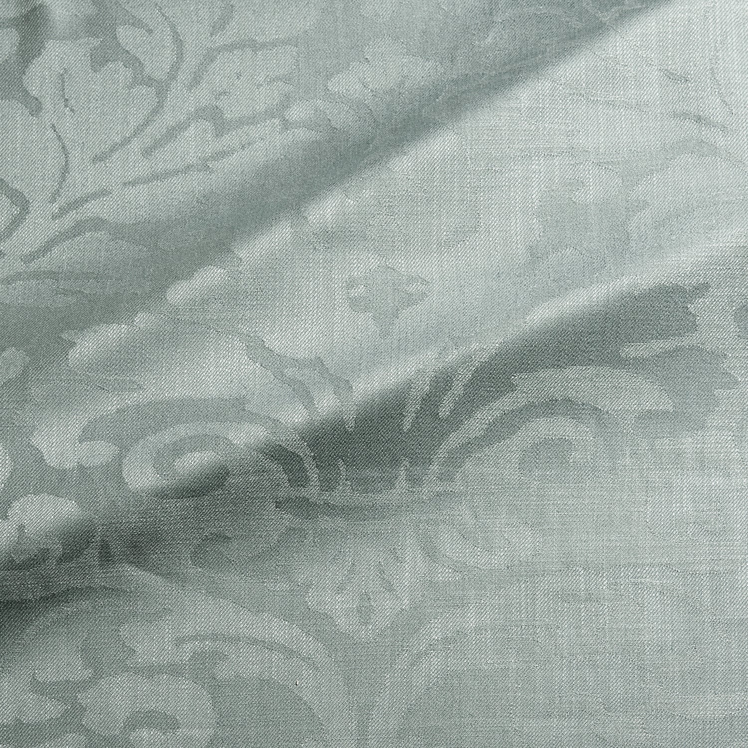 Fabric swatch of a contemporary damask fabric in a light blue colour for upholstery and curtains.