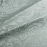 Fabric swatch of a contemporary damask fabric in a light blue colour for upholstery and curtains.