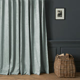 Curtains in a contemporary damask fabric with light blue colours.