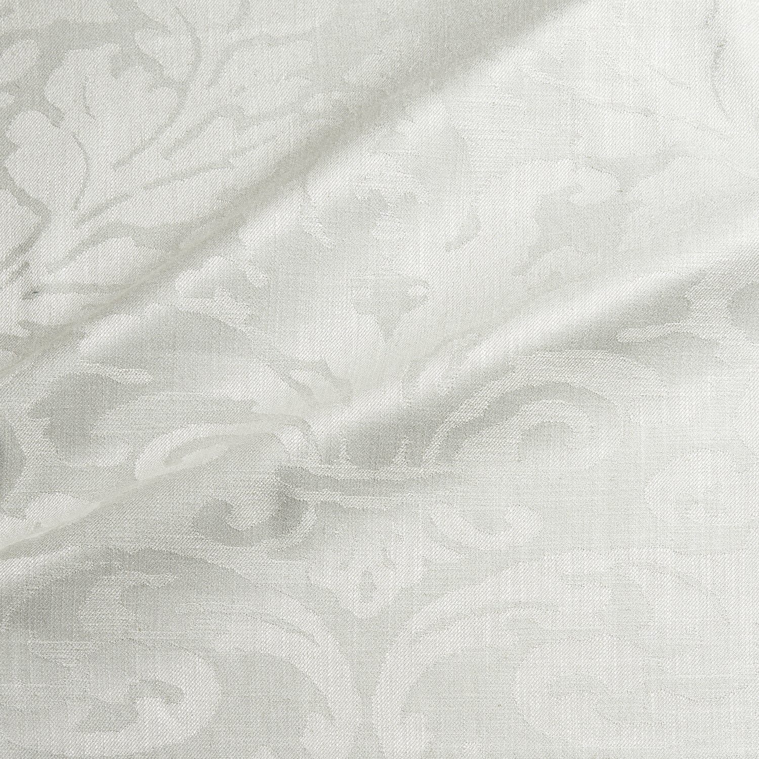 Fabric swatch of a contemporary damask fabric in a light neutral colour for upholstery and curtains.