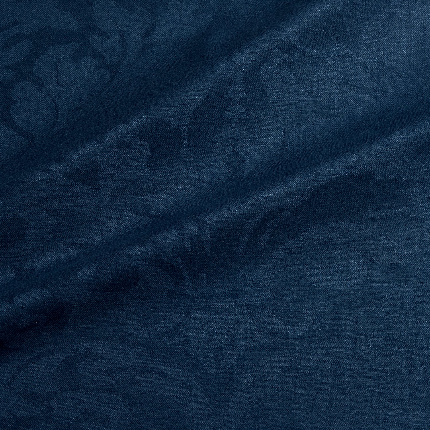 Fabric swatch of a contemporary damask fabric in a dark blue colour for upholstery and curtains.