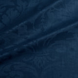 Fabric swatch of a contemporary damask fabric in a dark blue colour for upholstery and curtains.