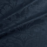 Fabric swatch of a contemporary damask fabric in a dark blue colour for upholstery and curtains.