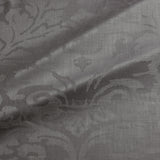 Fabric swatch of a contemporary damask fabric in a dark grey colour for upholstery and curtains.