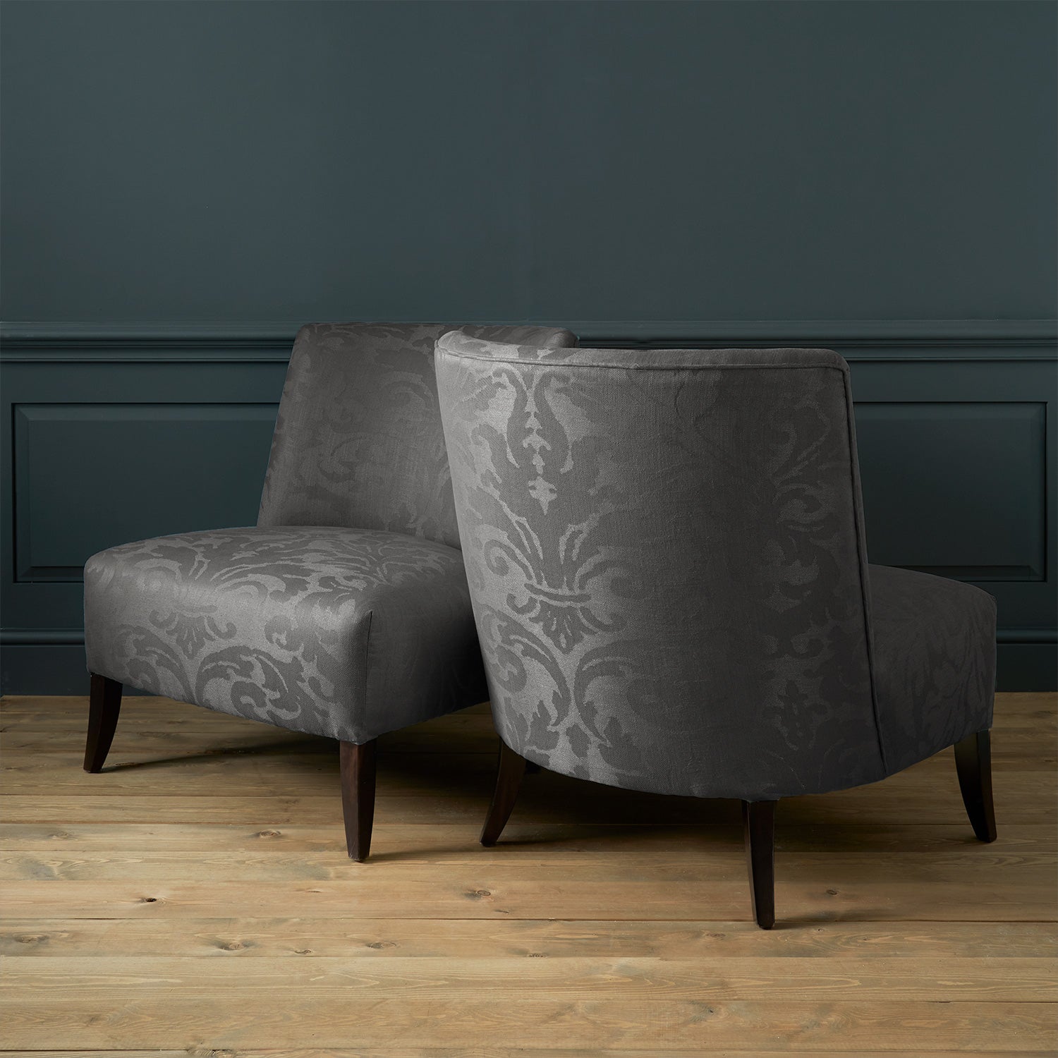 Armchairs in a contemporary damask fabric with dark grey colours.
