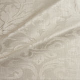 Fabric swatch of a contemporary damask fabric in a light neutral colour for upholstery and curtains.