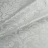 Fabric swatch of a contemporary damask fabric in a cream colour for upholstery and curtains.