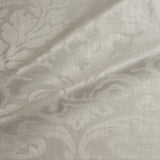 Fabric swatch of a contemporary damask fabric in a neutral colour for upholstery and curtains.