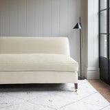 White velvet upholstery fabric on a classic sofa.