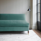 Blue velvet upholstery fabric on a classic sofa.