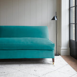 Blue velvet upholstery fabric on a classic sofa.
