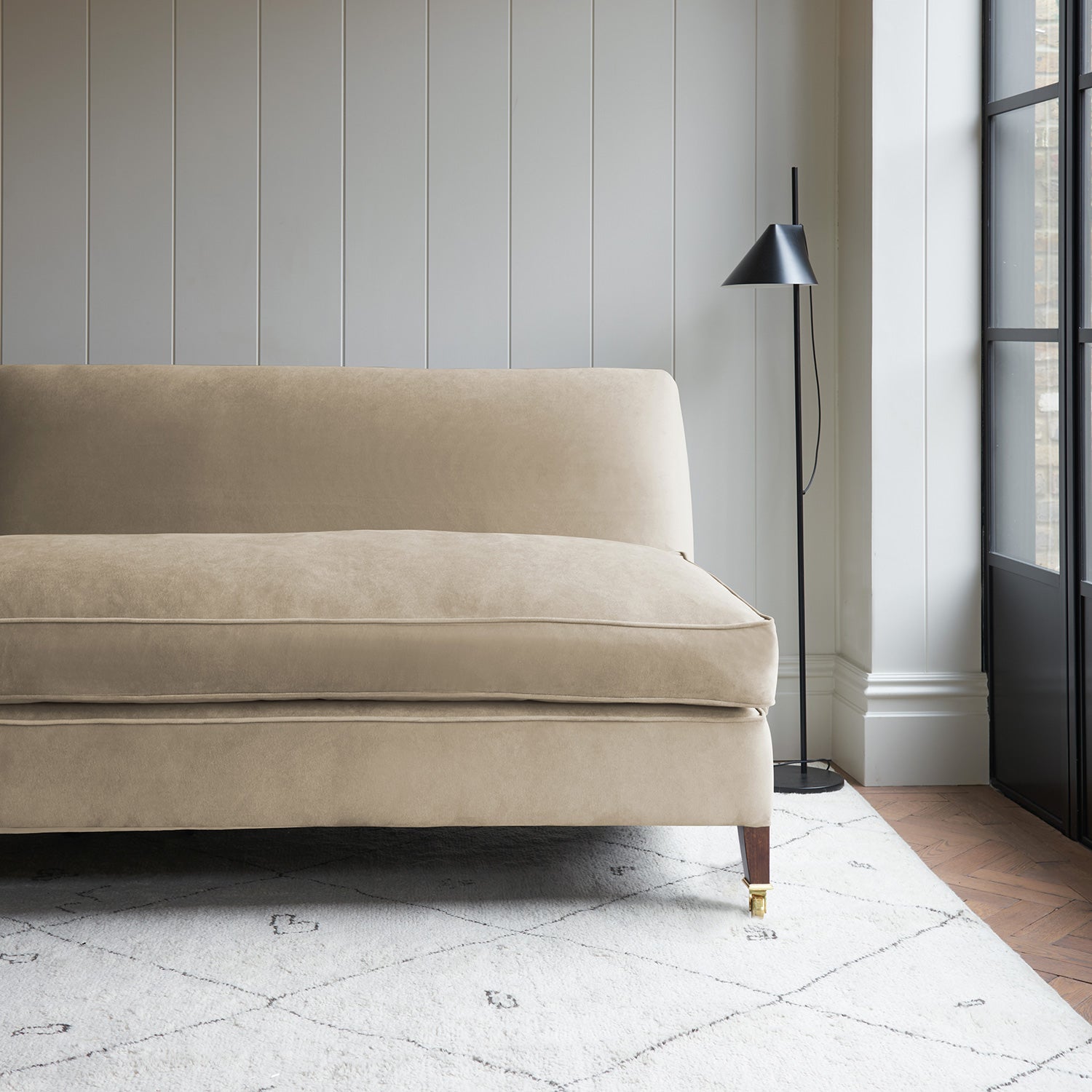 Cream velvet upholstery fabric on a classic sofa.