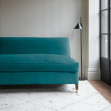 Blue velvet upholstery fabric on a classic sofa.
