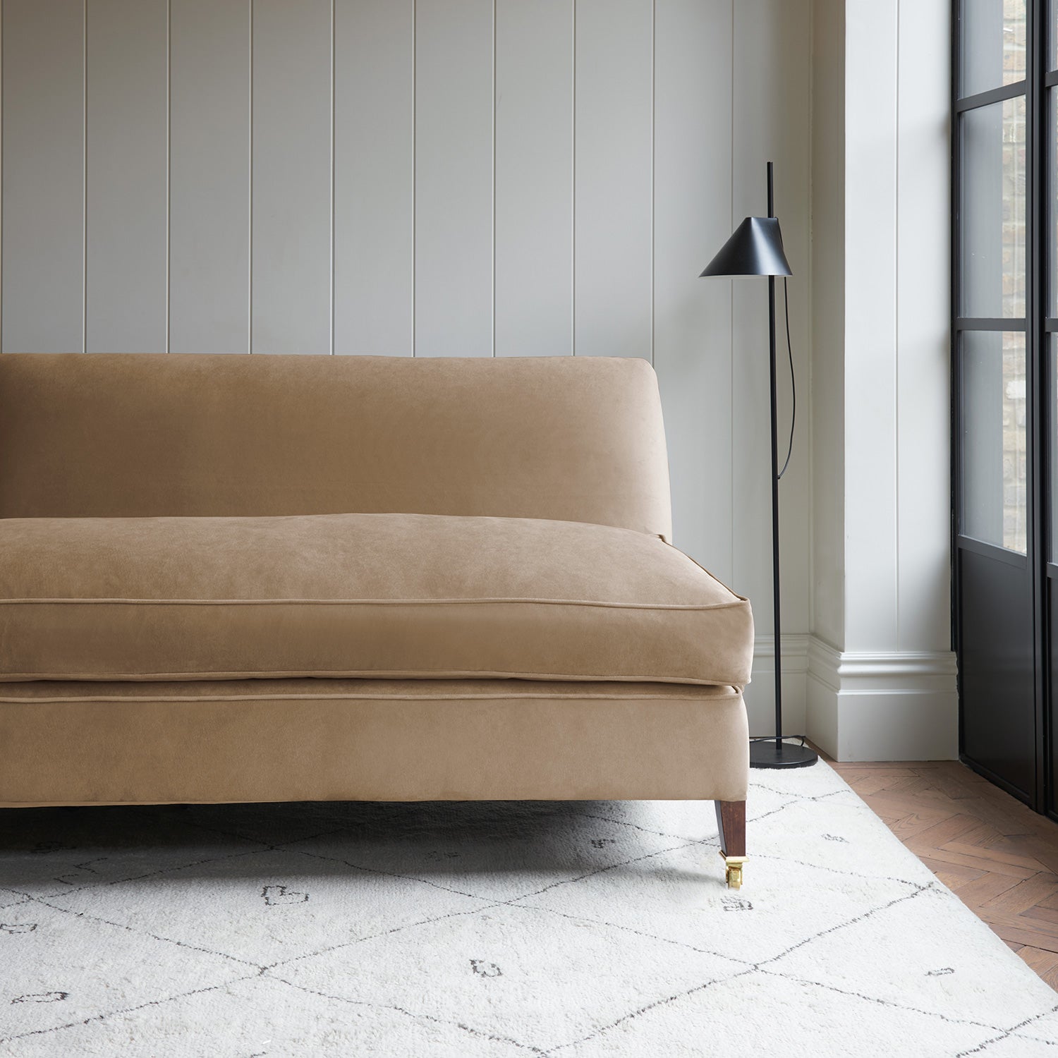 Brown velvet upholstery fabric on a classic sofa.