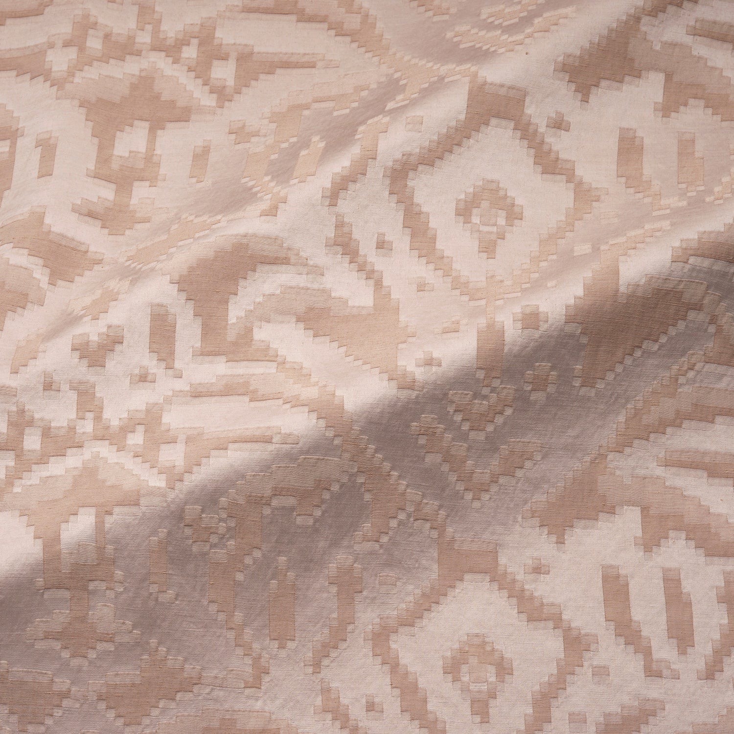 Fabric swatch of a soft blush pink fabric with jacquard design for curtain use