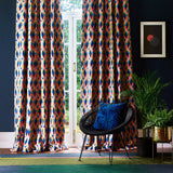 Velvet curtains in a bright coloured geometric fabric