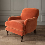 Orange eco velvet upholstery fabric on an armchair