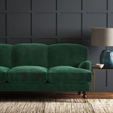 Green eco velvet upholstery fabric on a sofa