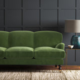 Green eco velvet upholstery fabric on a sofa