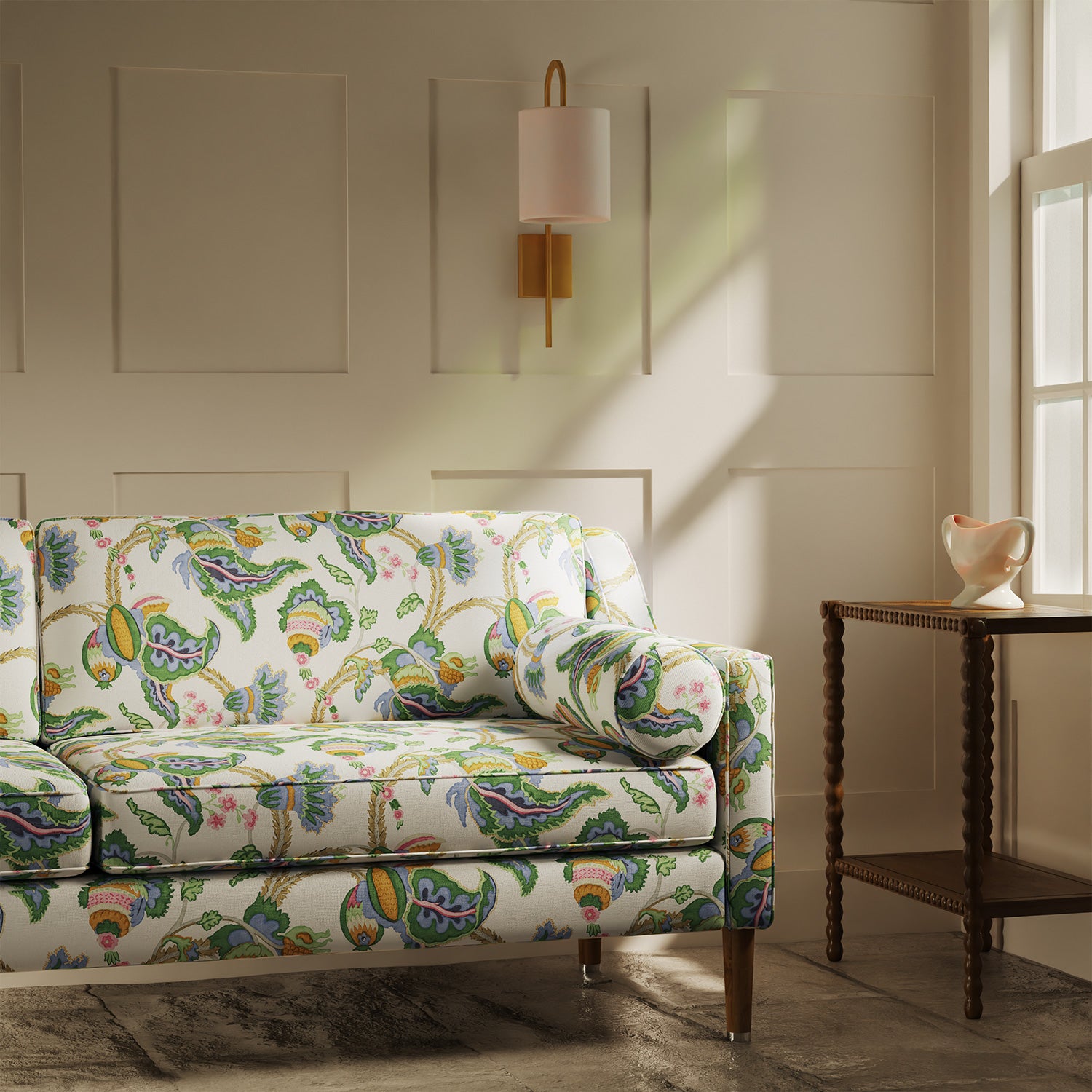Sofa upholstered in a linen fabric with a floral vine design