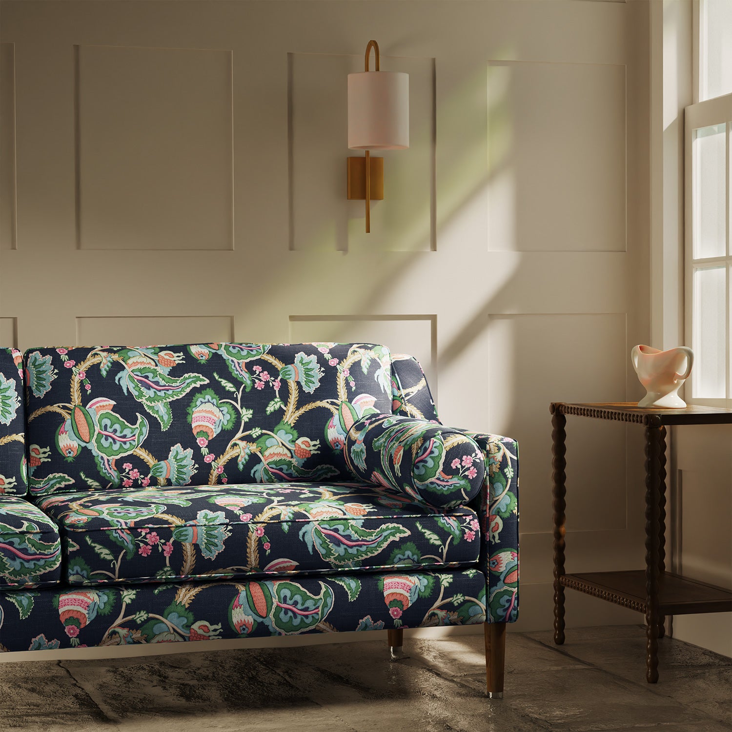Sofa upholstered in a linen fabric with a floral vine design
