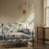 Sofa upholstered in a linen fabric with a floral vine design