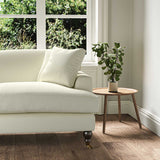 A cream stain resistant woven fabric on an armchair.