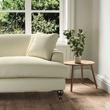 A cream stain resistant woven fabric on an armchair.