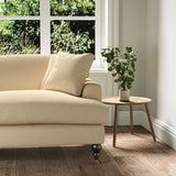 A gold stain resistant woven fabric on an armchair.