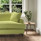 A green stain resistant woven fabric on an armchair.
