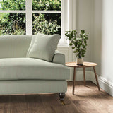 A grey stain resistant woven fabric on an armchair.