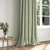 A green woven fabric shown as a curtain.