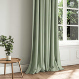 A green woven fabric shown as a curtain.
