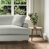 A grey stain resistant woven fabric on an armchair.