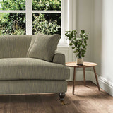 A brown stain resistant woven fabric on an armchair.