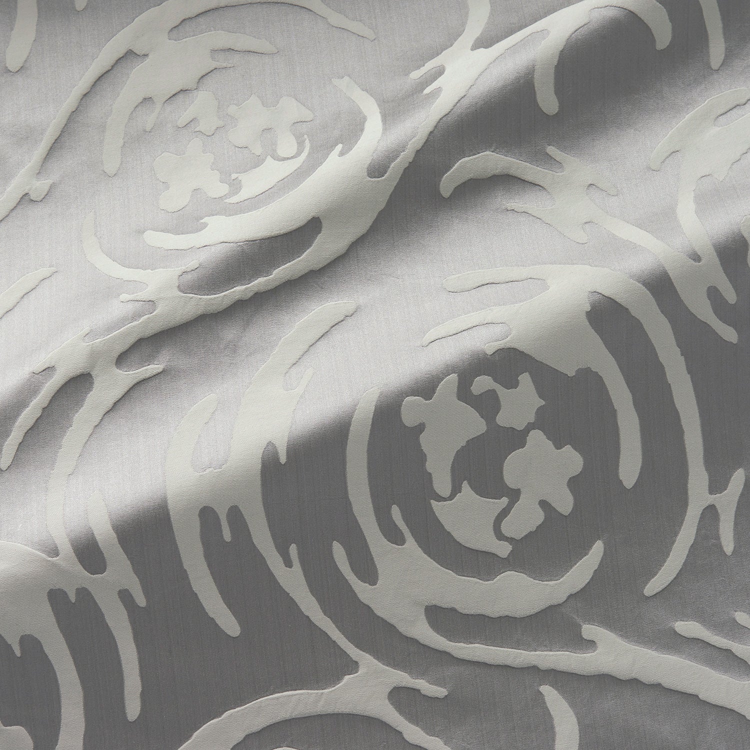 Fabric swatch of a beautiful grey coloured abstract swirl fabric suitable for curtains