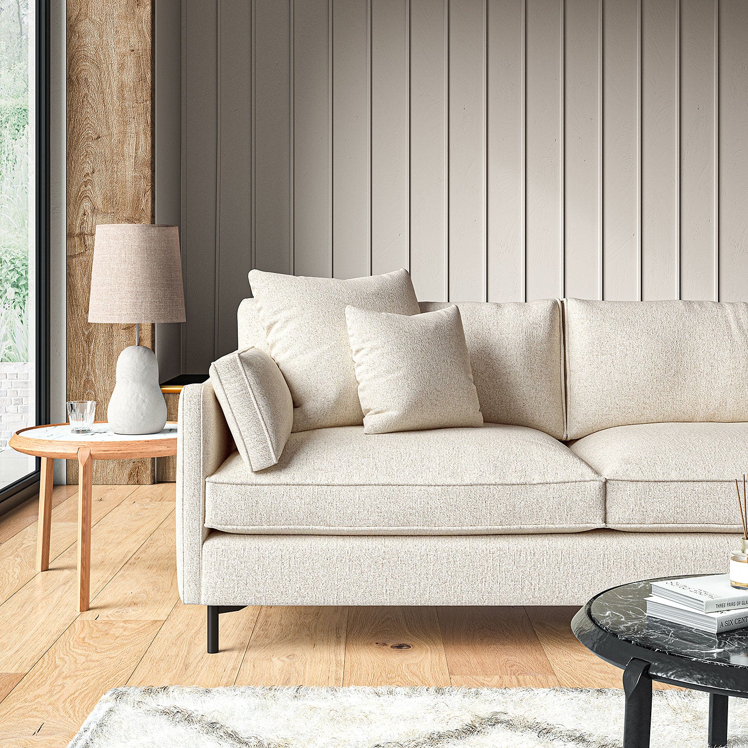 Sofa covered in a boucle fabric in Almond