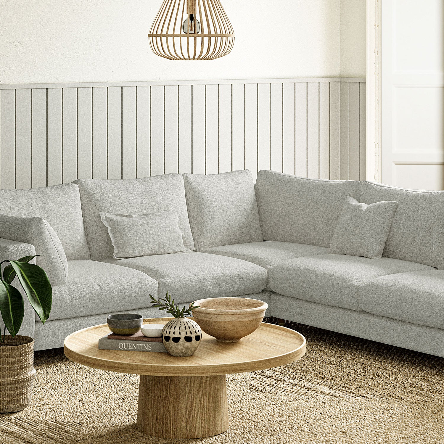 Sofa covered in a boucle fabric in Linen