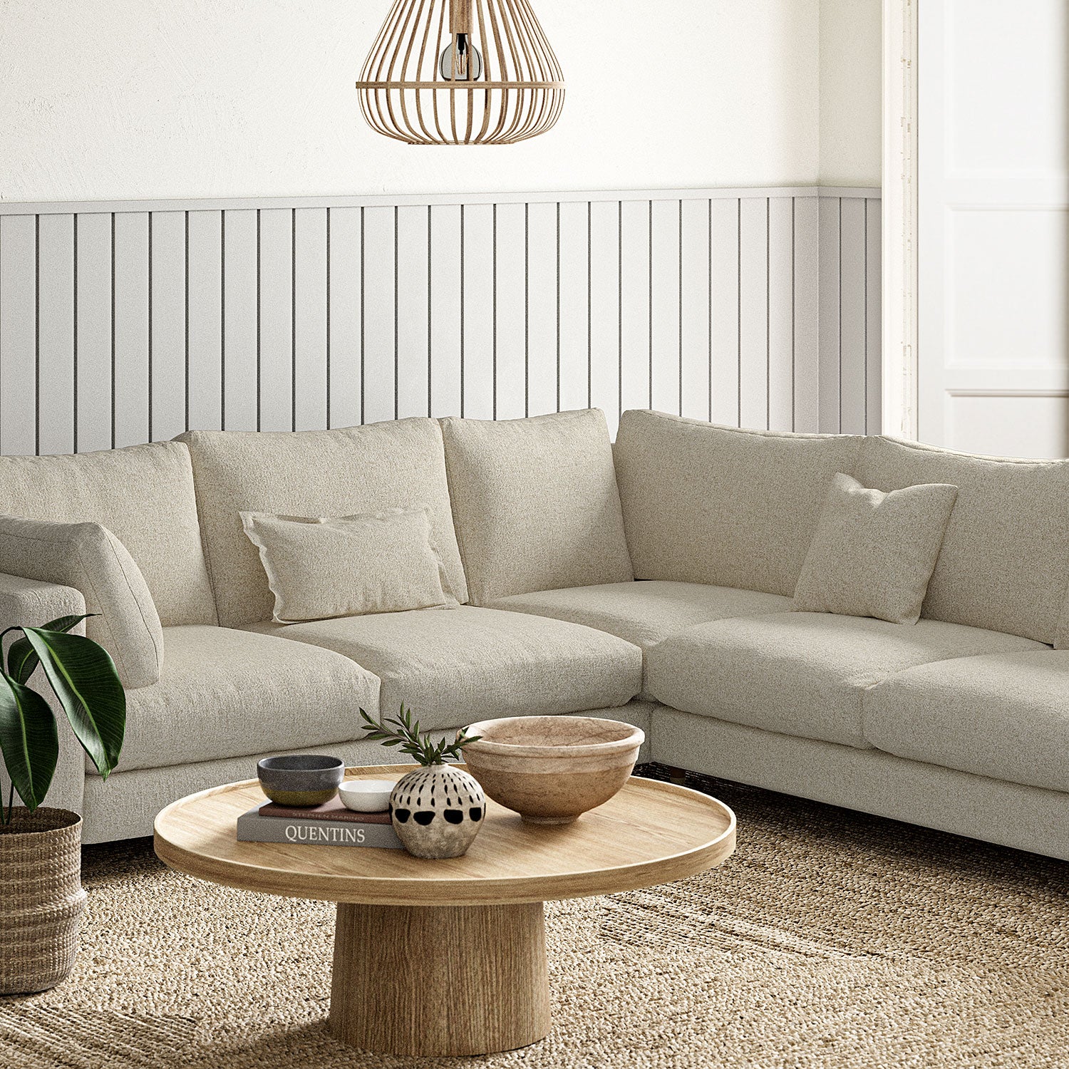 Sofa covered in a boucle fabric in Pumice