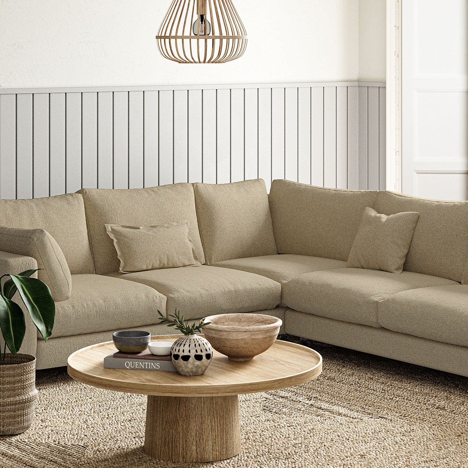 Sofa covered in a boucle fabric in Fudge