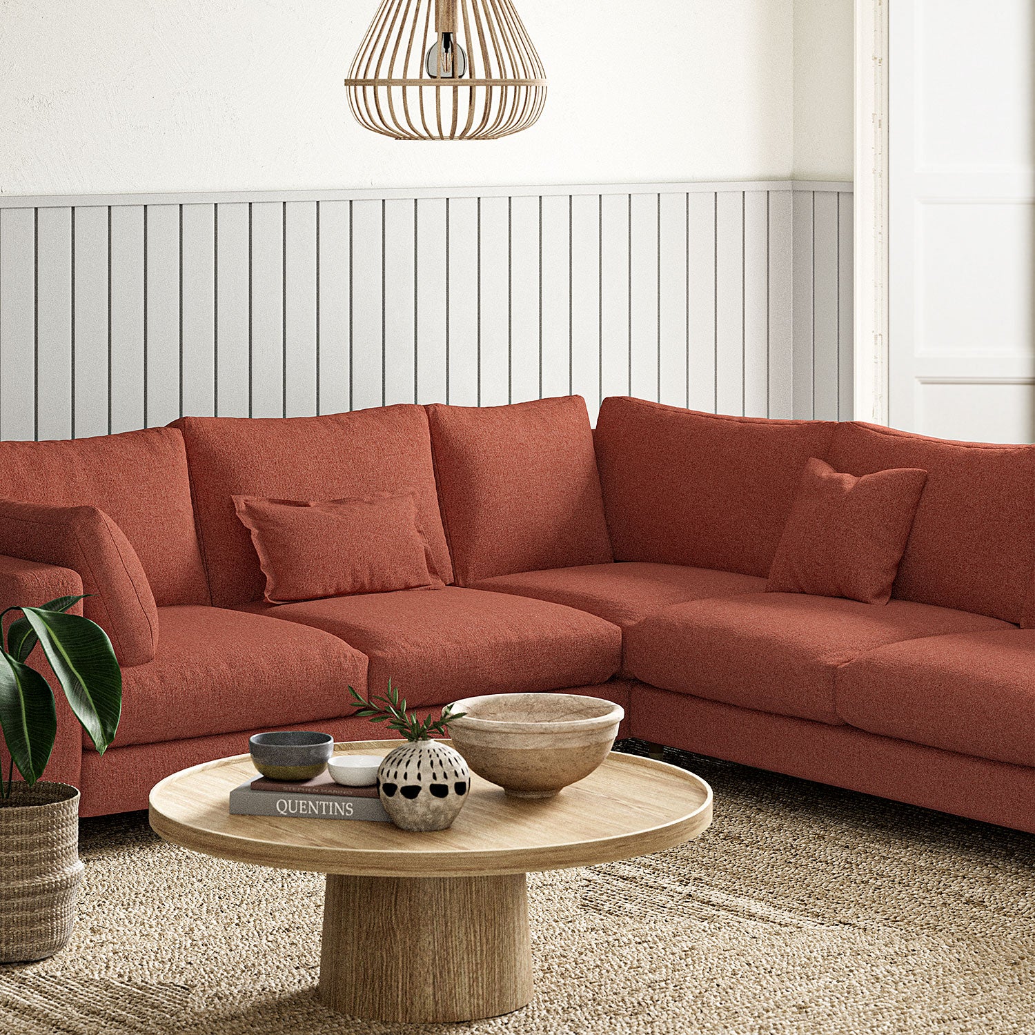 Sofa covered in a boucle fabric in Carnelian