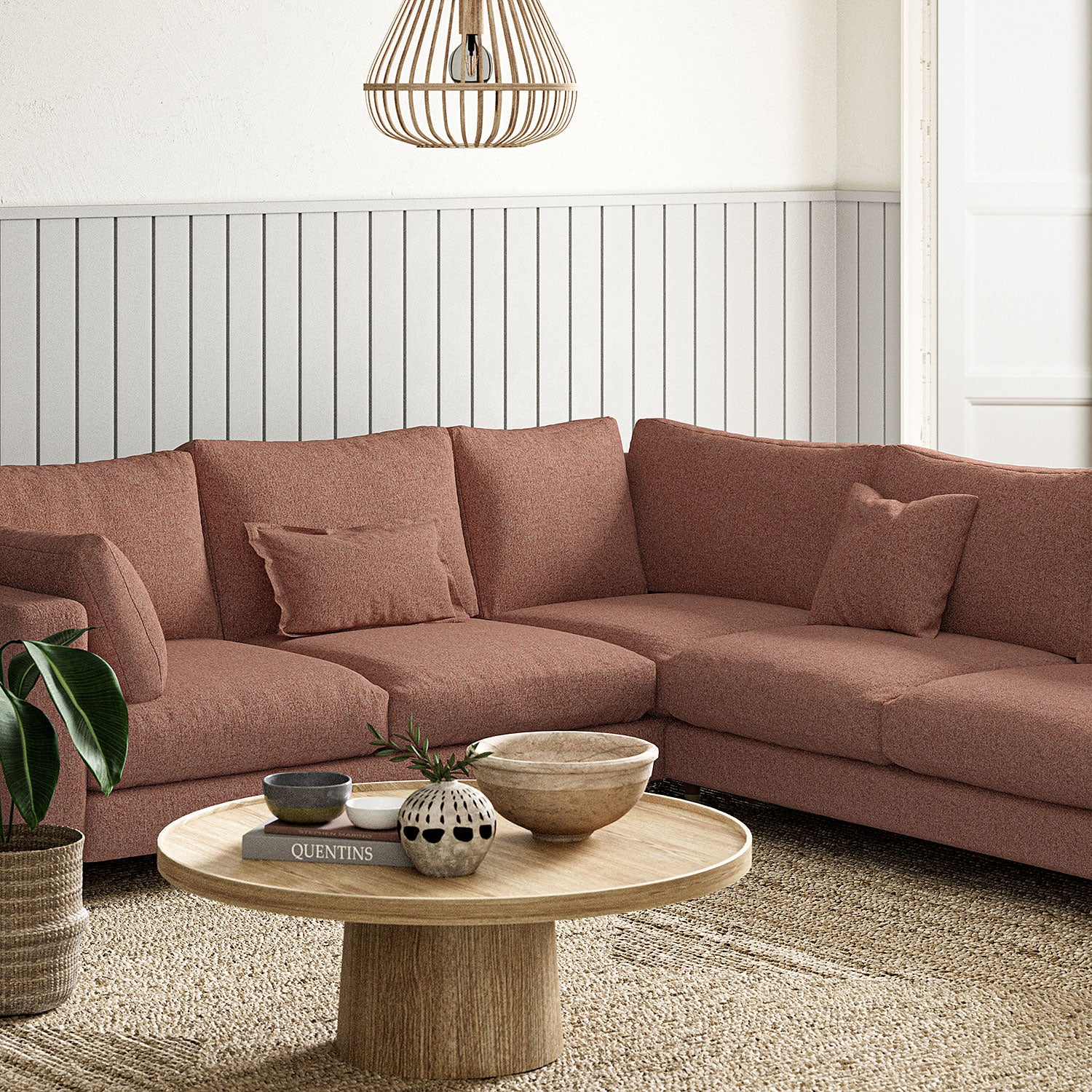 Sofa covered in a boucle fabric in Rose