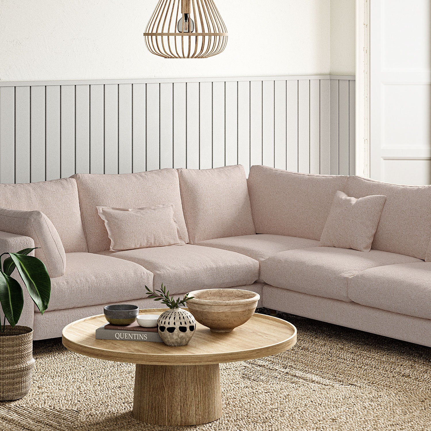 Sofa covered in a boucle fabric in Pale Pink