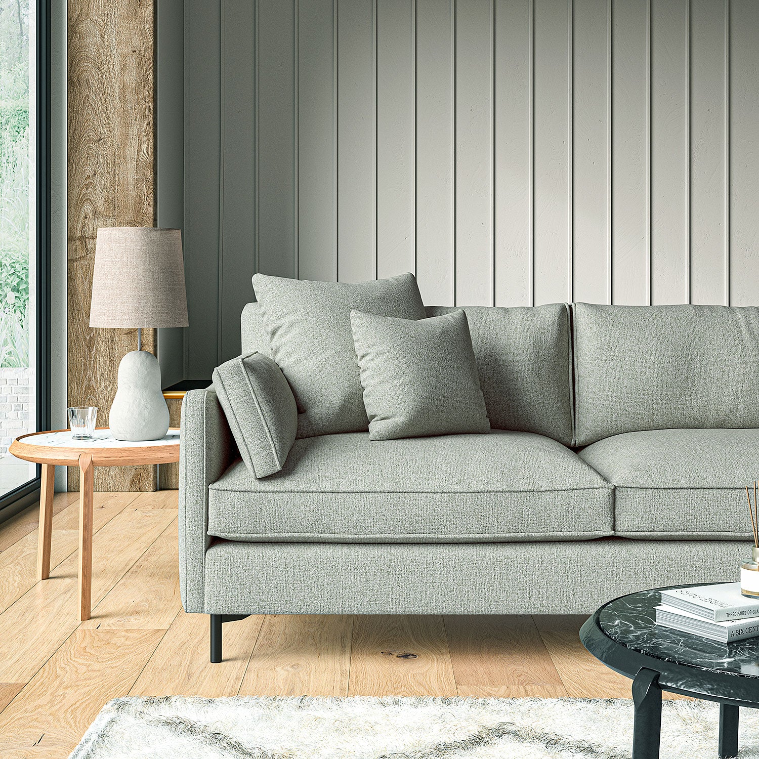 Sofa covered in a boucle fabric in Mineral