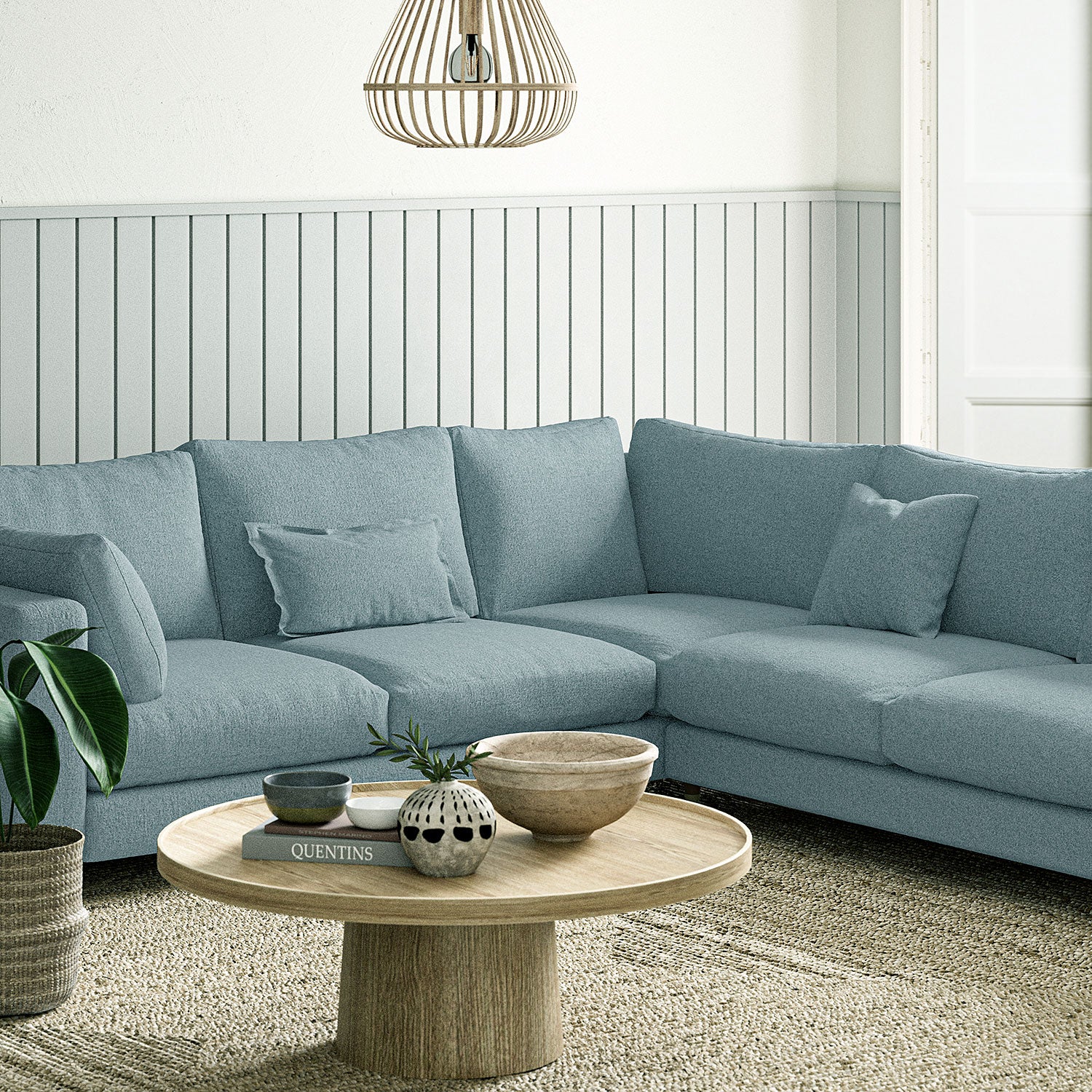 Sofa covered in a boucle fabric in Cornflower