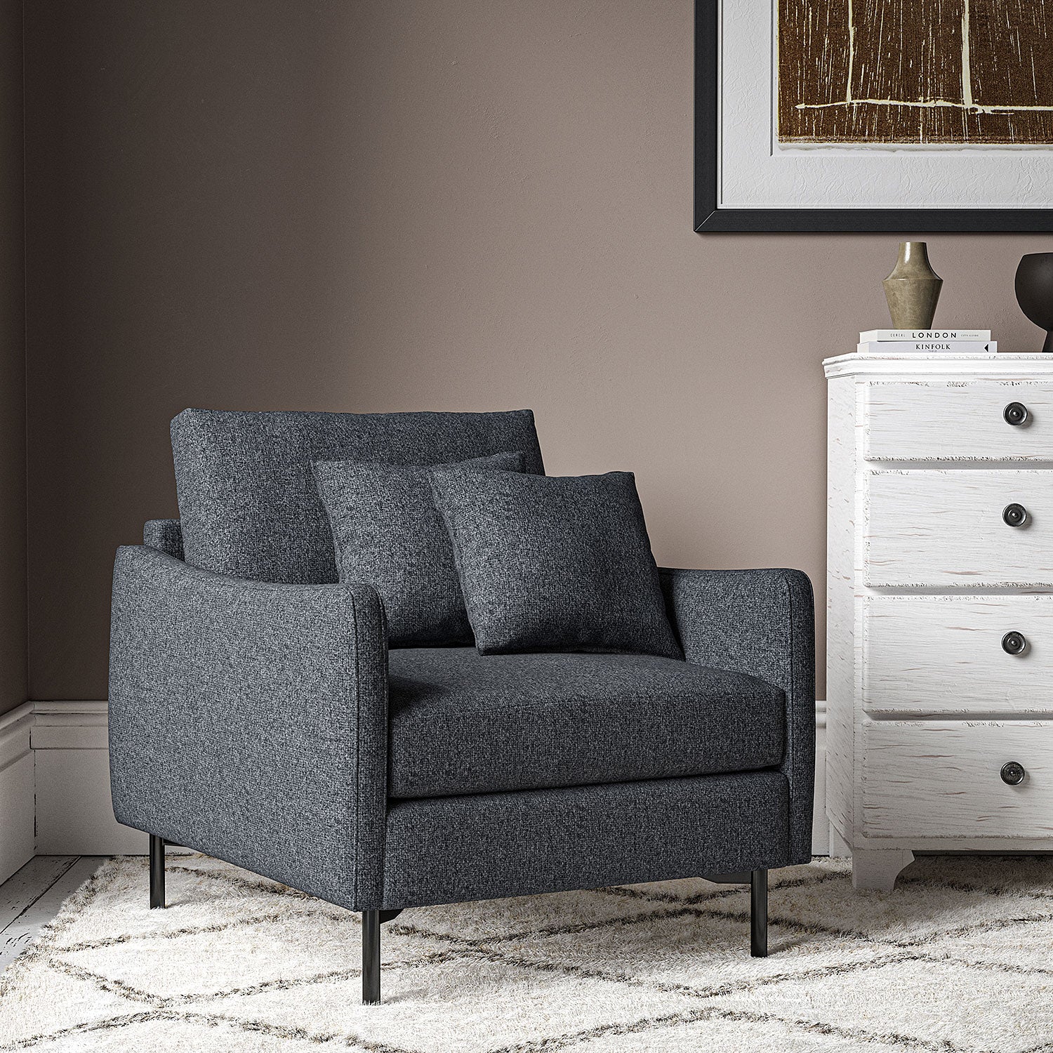 Chair covered in a boucle fabric in Ink