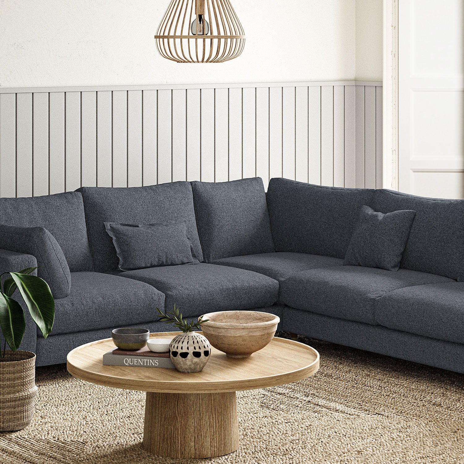 Sofa covered in a boucle fabric in Ink