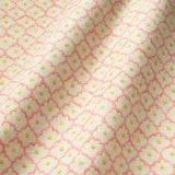 Printed linen fabric sample - a classic trellis design in pink, yellow, and cream