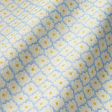 Printed linen fabric sample - a classic trellis design in blue, yellow, and cream